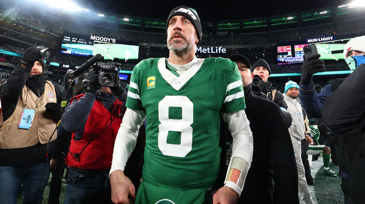 New York Jets quarterback Aaron Rodgers (8) walks on the field after the Jets win over the Miami Dolphins at MetLife Stadium.