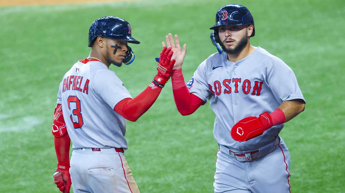 Mar 30, 2025; Arlington, Texas, USA; Boston Red Sox right fielder Wilyer Abreu (52) celebrates with Boston Red Sox center fielder Ceddanne Rafaela (3) after scoring during the sixth inning against the Texas Rangers at Globe Life Field. Mandatory Credit: Kevin Jairaj-Imagn Images