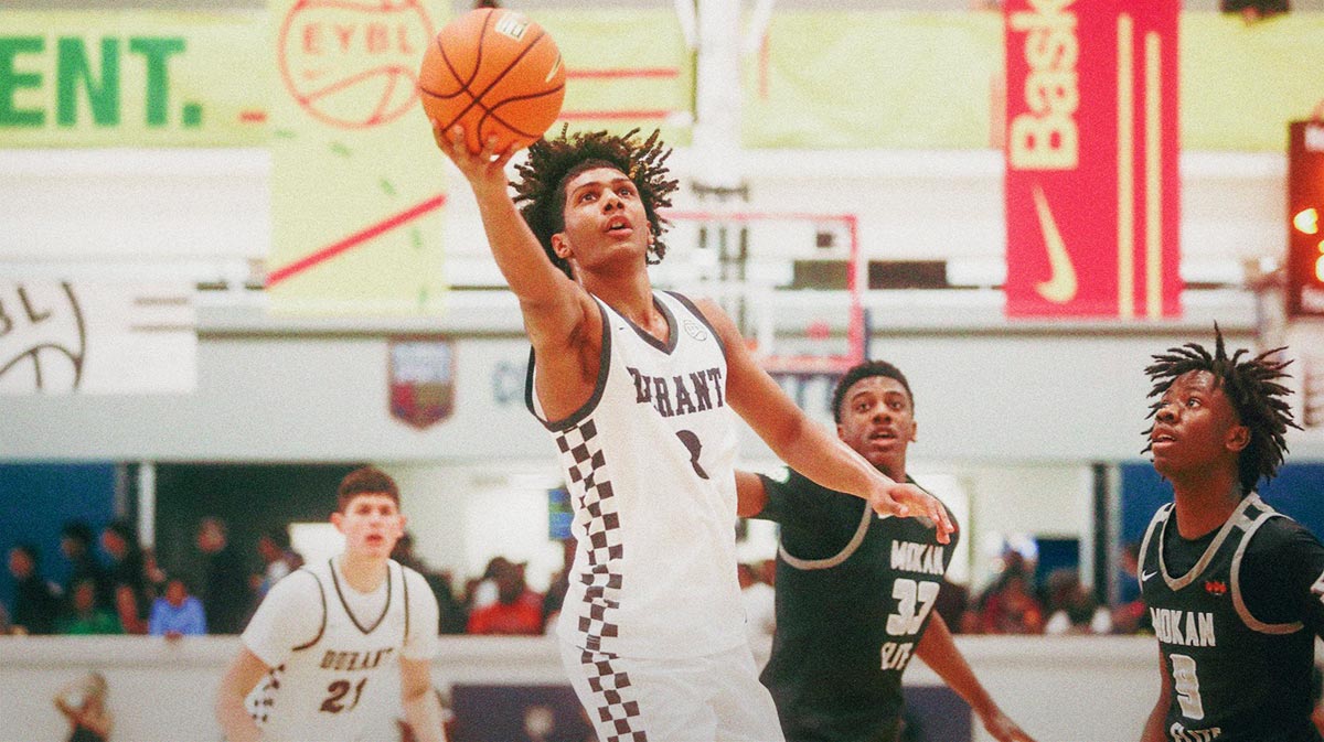 Acaden Lewis (8) goes for a lay up during a game against Team Mokan Elite during the Nike Elite Youth Basketball League session one