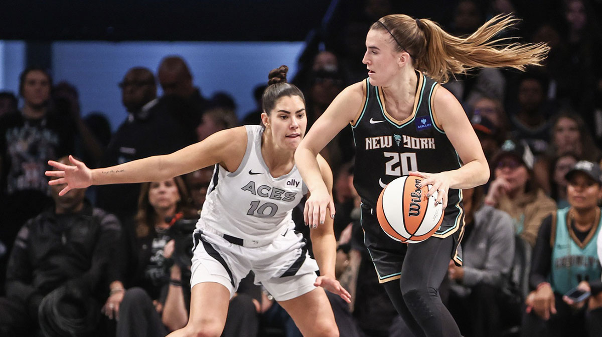 Aces' Kelsey Plum guards Liberty's Sabrina Ionescu during 2024 WNBA Semi-finals.