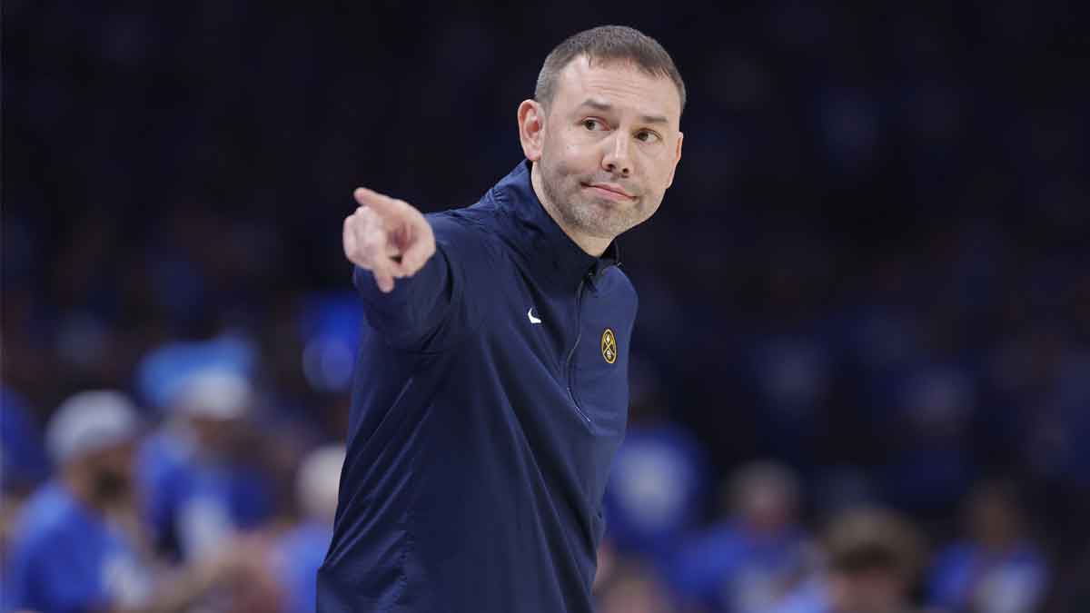 Denver Nuggets head coach David Adelman points down the court during a play against the Oklahoma City Thunder in the second quarter during game seven of the second round for the 2025 NBA Playoffs at Paycom Center.
