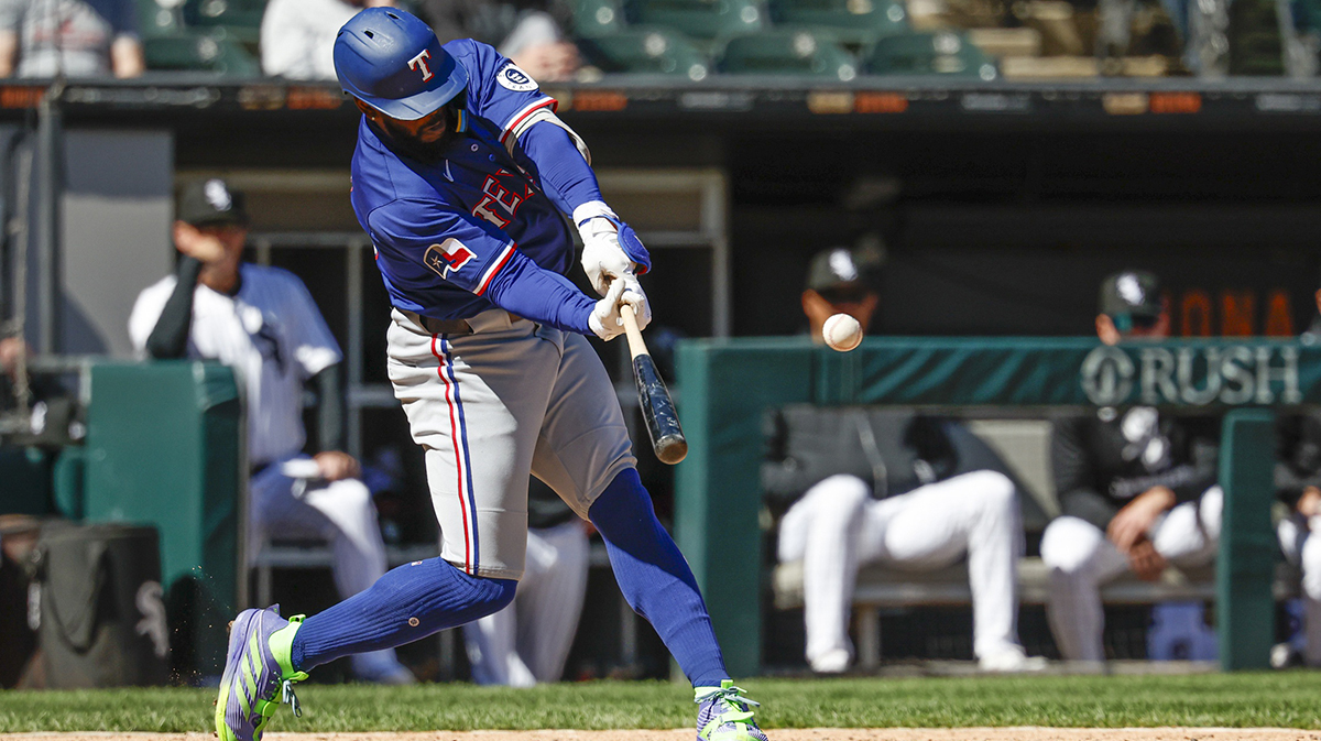 Texas Rangers right fielder Adolis García (53) hits a two-run double against the Chicago White Sox during the ninth inning at Rate Field.