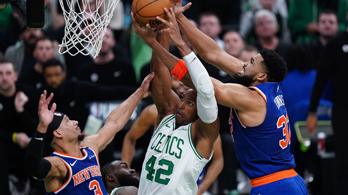 New York Knicks center Karl-Anthony Towns (32) and Boston Celtics center Al Horford (42) work for the ball in the fourth quarter during game one of the second round for the 2025 NBA Playoffs at TD Garden.
