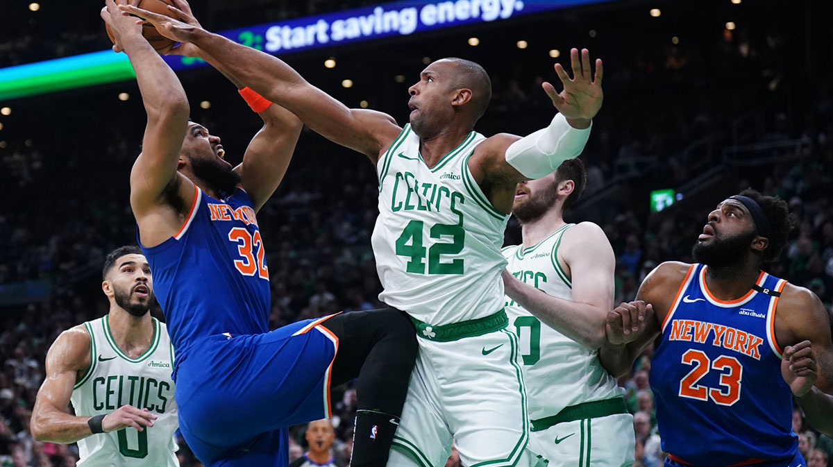 New York Knicks center Karl-Anthony Towns (32) shoots the ball agai9nst Boston Celtics center Al Horford (42) in the first quarter during game one of the second round for the 2025 NBA Playoffs at TD Garden.