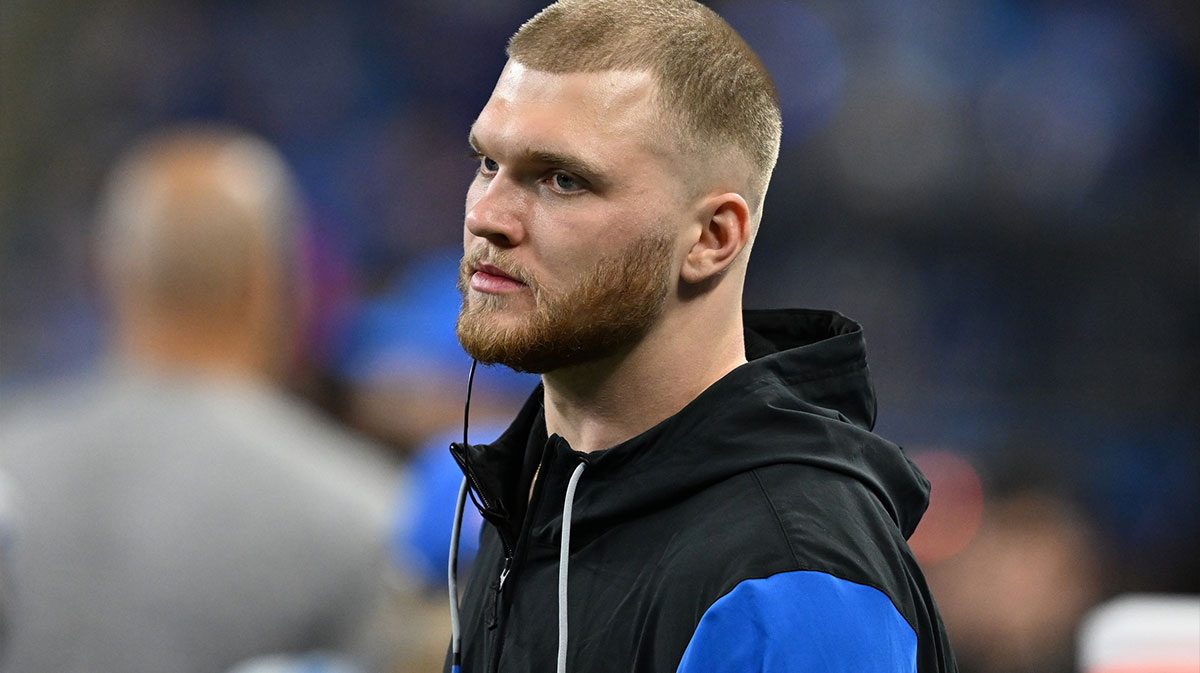 Detroit Lions defensive lineman Aidan Hutchinson (97) looks on from the bench during the fourth quarter against the Washington Commanders in a 2025 NFC divisional round game at Ford Field