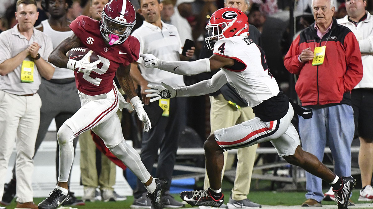 Alabama Crimson Tide wide receiver Ryan Williams (2) breaks a tackle by Georgia Bulldogs defensive back KJ Bolden (4) to score a touchdown that put Alabama ahead in the fourth quarter at Bryant-Denny Stadium. Alabama defeated Georgia 41-34.