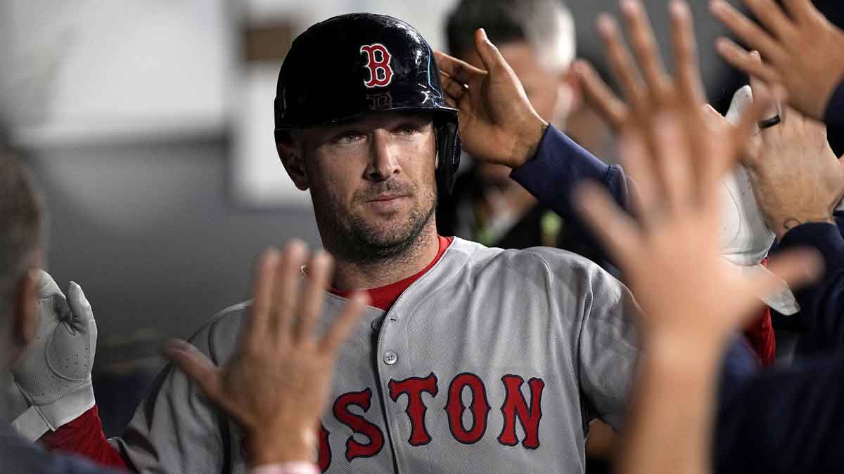 Boston Red Sox third baseman Alex Bregman (2) is congratulated after scoring against the Toronto Blue Jays during the ninth inning.