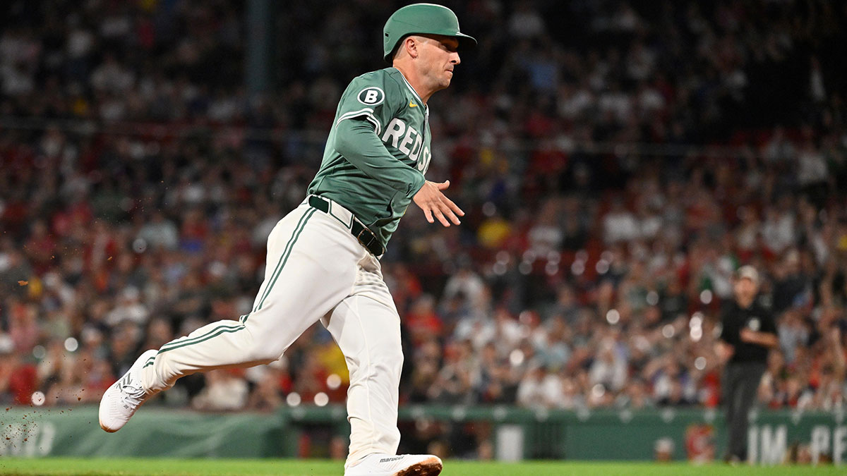 Boston Red Sox third base Alex Bregman (2) scores on a RBI single by shortstop Trevor Story (not pictured) during the ninth inning against the Atlanta Braves at Fenway Park.