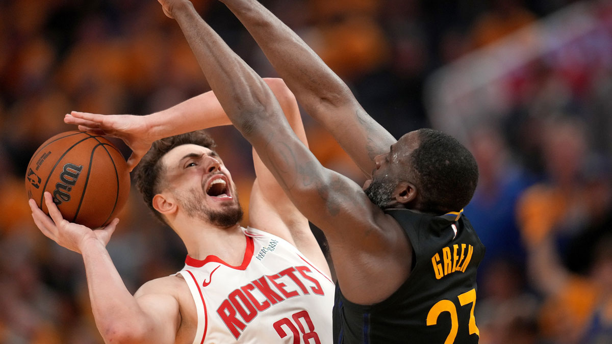 Houston Rockets center Alperen Sengun (28) shoots the ball around the reach of Golden State Warriors forward Draymond Green (23) in the fourth quarter of game six of the first round for the 2025 NBA Playoffs at Chase Center.