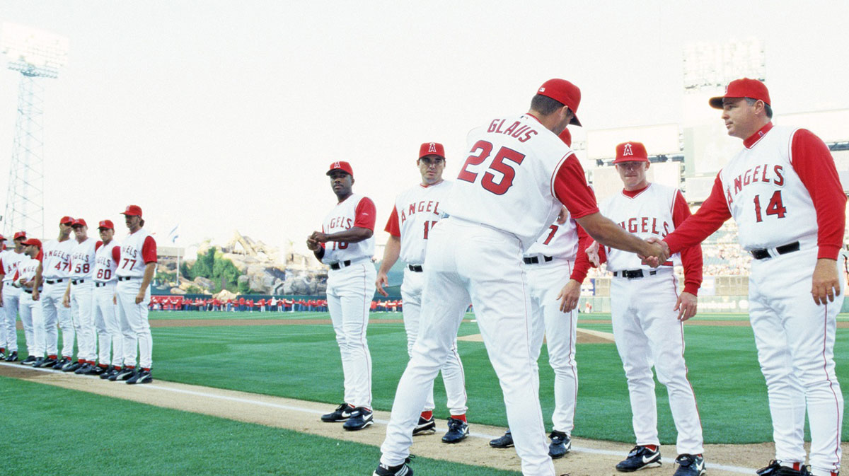 March 31, 2002; Anaheim, CA, USA; FILE PHOTO; Anaheim Angels third baseman Troy Glaus (25) greets manager Mike Scioscia (14) and team members during 2002 pregame season opener against the Cleveland Indians at Edison Field. Mandatory Credit: VJ Lovero-USA TODAY NETWORK