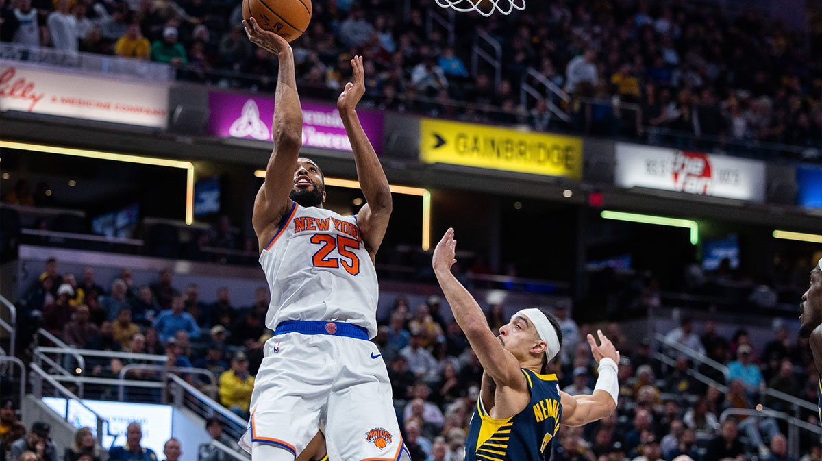 New York Knicks forward Mikal Bridges (25) shoots the ball while Indiana Pacers guard Andrew Nembhard (2) defends in the second half at Gainbridge Fieldhouse.