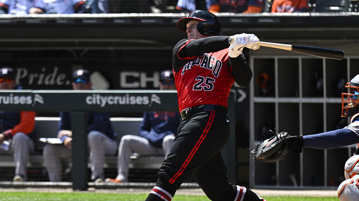 May 3, 2025; Chicago, Illinois, USA; Chicago White Sox first baseman Andrew Vaughn (25) hits a two RBI single against the Houston Astros during the first inning at Rate Field.