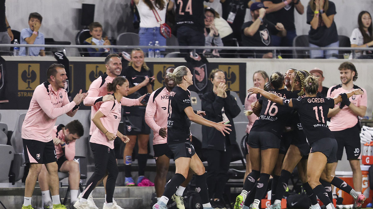 Angel City FC forward Christen Press celebrates with her teammates after scoring a goal during the second half of a NWSL soccer game against the Utah Royals at BMO Stadium.