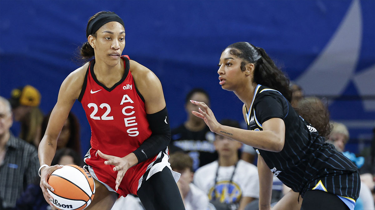 Las Vegas Aces center A'ja Wilson (22) is defended by Chicago Sky forward Angel Reese (5) during the first half at Wintrust Arena.