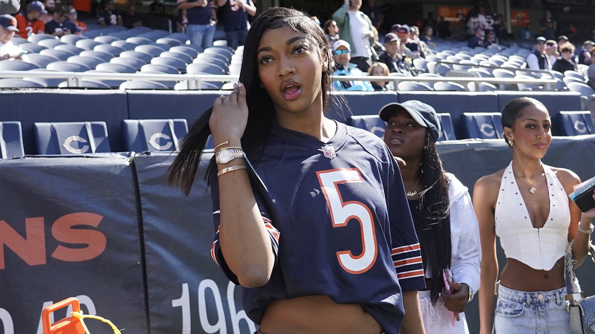 WNBA Chicago Sky player Angel Reese on the sidelines before the game between the Chicago Bears and the Carolina Panthers at Soldier Field.
