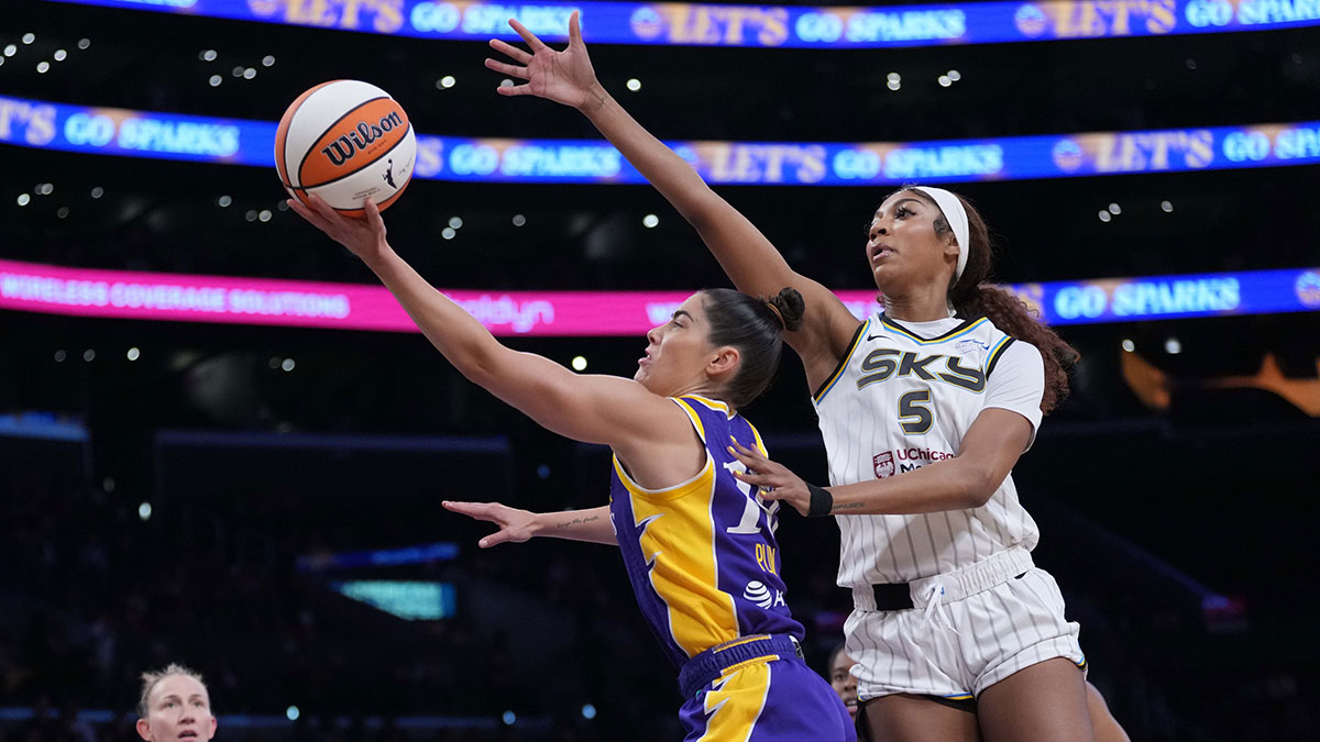 LA Sparks guard Kelsey Plum (10) shoots the ball against Chicago Sky forward Angel Reese (5) in the first half at Crypto.com Arena.