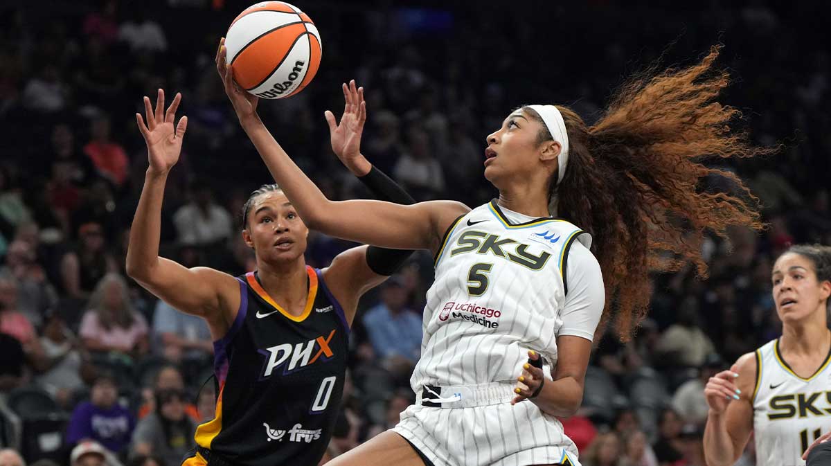 Chicago Sky forward Angel Reese (5) drives on Phoenix Mercury forward Satou Sabally (0) in the first half at Footprint Center.
