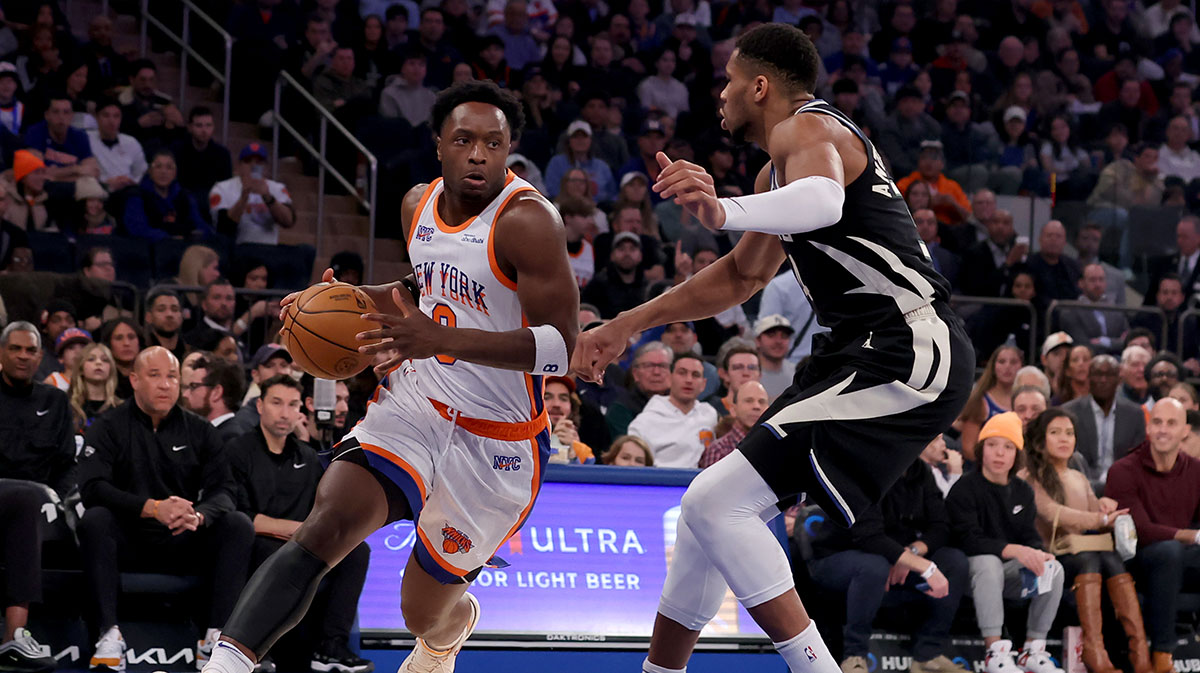 New York Knicks forward OG Anunoby (8) drives to the basket against Milwaukee Bucks forward Giannis Antetokounmpo (34) during the first quarter at Madison Square Garden.