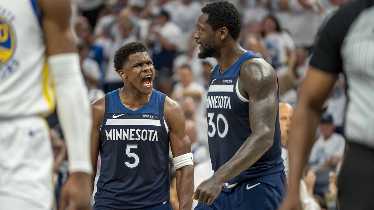Minnesota Timberwolves guard Anthony Edwards (5) celebrates with Minnesota Timberwolves forward Julius Randle (30) after making a shot against the Golden State Warriors in the first half during game five of the second round for the 2025 NBA Playoffs at Target Center.