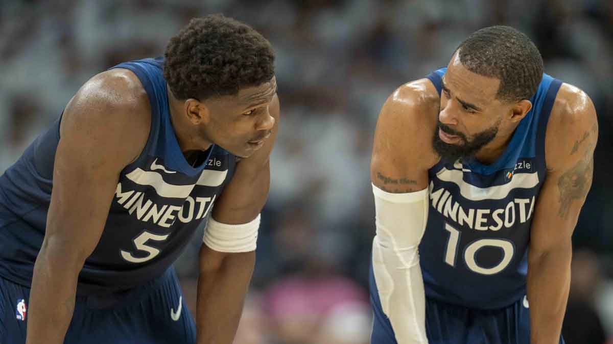 Minnesota Timberwolves guard Anthony Edwards (5) looks on with Minnesota Timberwolves guard Mike Conley (10) against the Golden State Warriors in the first half during game five of the second round for the 2025 NBA Playoffs at Target Center.