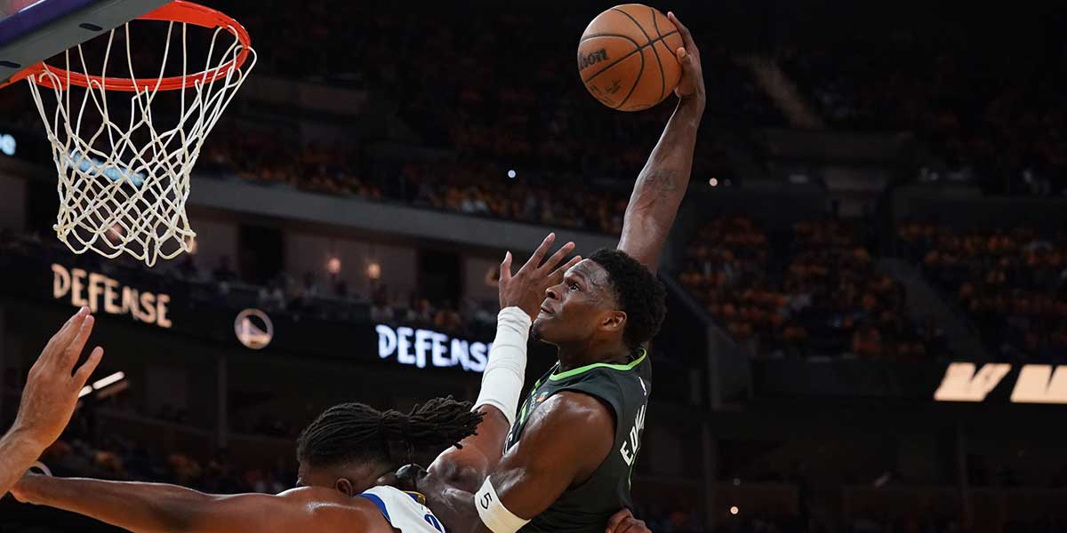 Minnesota Timberwolves guard Anthony Edwards (5) dunks over Golden State Warriors forward Kevon Looney (5) in the third quarter during game three in the second round for the 2025 NBA Playoffs at Chase Center.