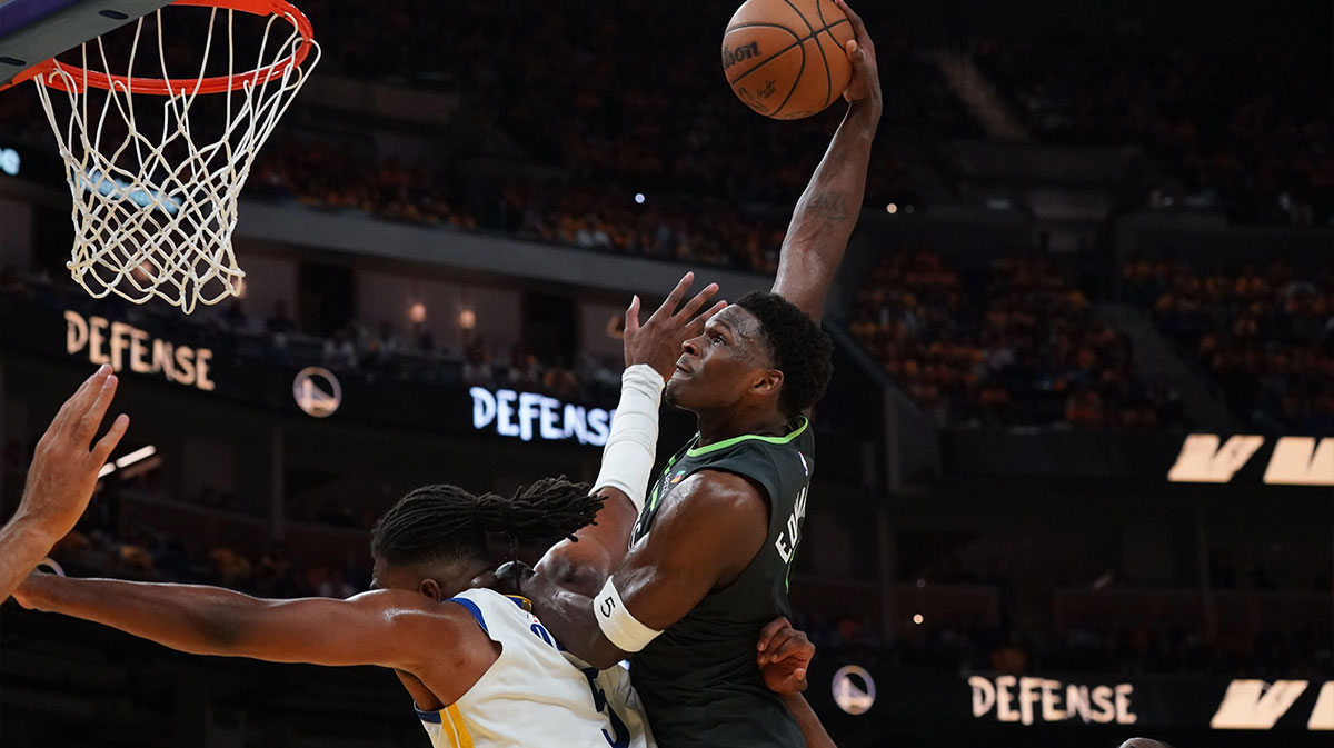 Minnesota Timberwolves guard Anthony Edwards (5) dunks over Golden State Warriors forward Kevon Looney (5) in the third quarter during game three in the second round for the 2025 NBA Playoffs at Chase Center.