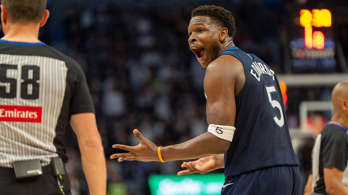 Minnesota Timberwolves guard Anthony Edwards (5) argues with referee Josh Tiven (58) after a foul against the Los Angeles Lakers bench in the second quarter during game four of first round for the 2025 NBA Playoffs at Target Center.