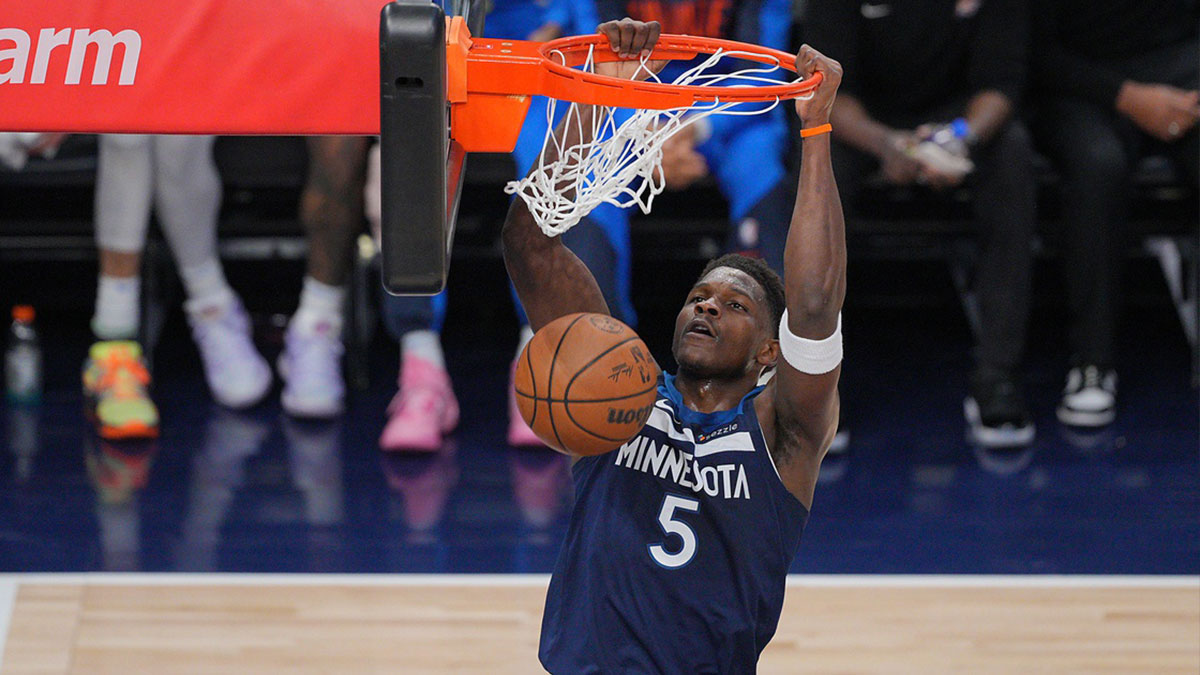 Minnesota Timberwolves guard Anthony Edwards (5) dunks the ball against the Oklahoma City Thunder during the first half in game three of the western conference finals for the 2025 NBA Playoffs at Target Center.