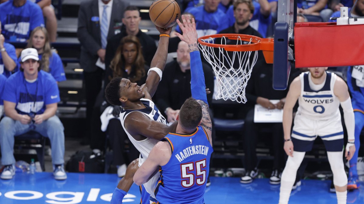 Minnesota Timberwolves guard Anthony Edwards (5) shoots against Oklahoma City Thunder center Isaiah Hartenstein (55) in the second quarter during game two of the western conference finals for the 2025 NBA Playoffs at Paycom Center.