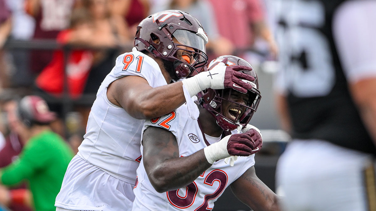 Virginia Tech Hokies defensive lineman Wilfried Pene (91) and Virginia Tech Hokies defensive lineman Antwaun Powell-Ryland (52) celebratione a sack against the Vanderbilt Commodores during the first half at FirstBank Stadium.