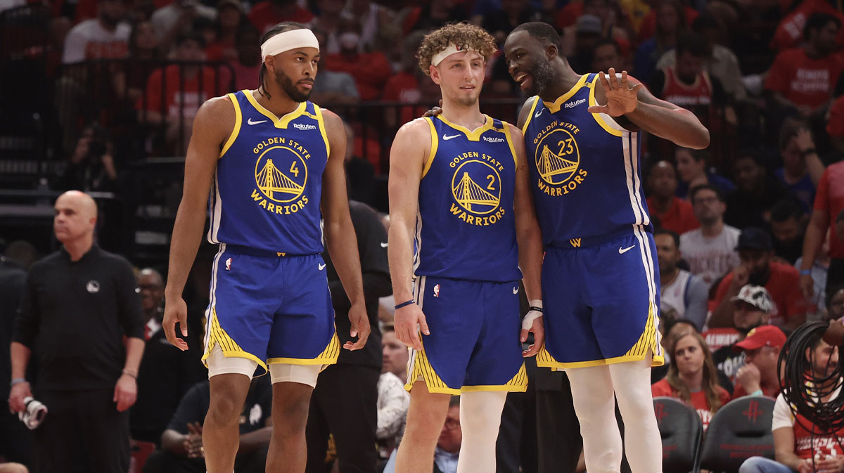 Golden State Warriors forward Draymond Green (23) talks to guard Brandin Podziemski (2) and guard Moses Moody (4) before playing against the Houston Rockets in the second quarter during game five of first round for the 2025 NBA Playoffs at Toyota Center.