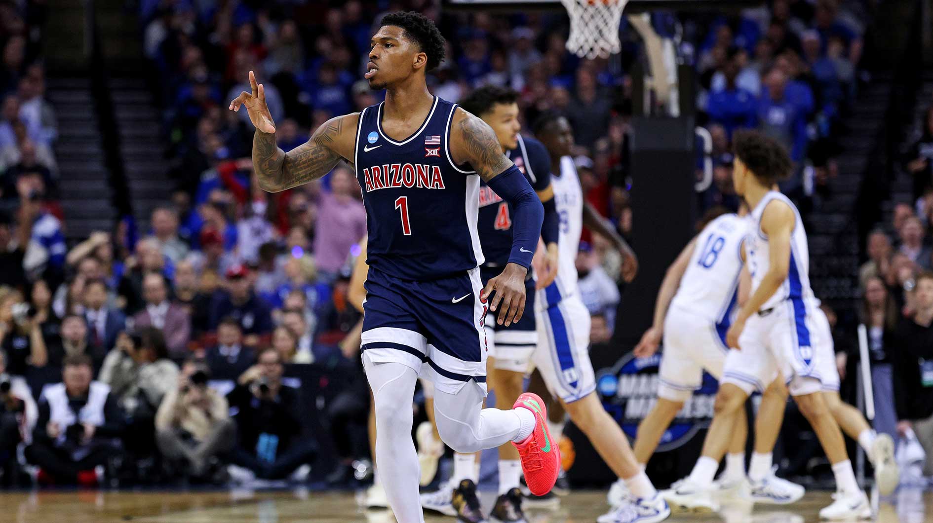 Arizona Wildcats guard Caleb Love (1) celebrates after a play during the first half against the Duke Blue Devils during an East Regional semifinal of the 2025 NCAA tournament at Prudential Center.