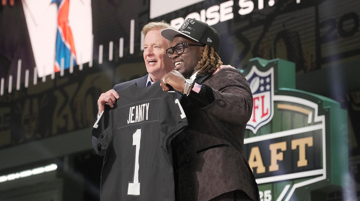 NFL Commissioner Rodger Goodell, left, with Boise State Broncos running back Ashton Jeanty is selected by the Las Vegas Raiders as the number six pick in the first round of the 2025 NFL Draft at Lambeau Field.