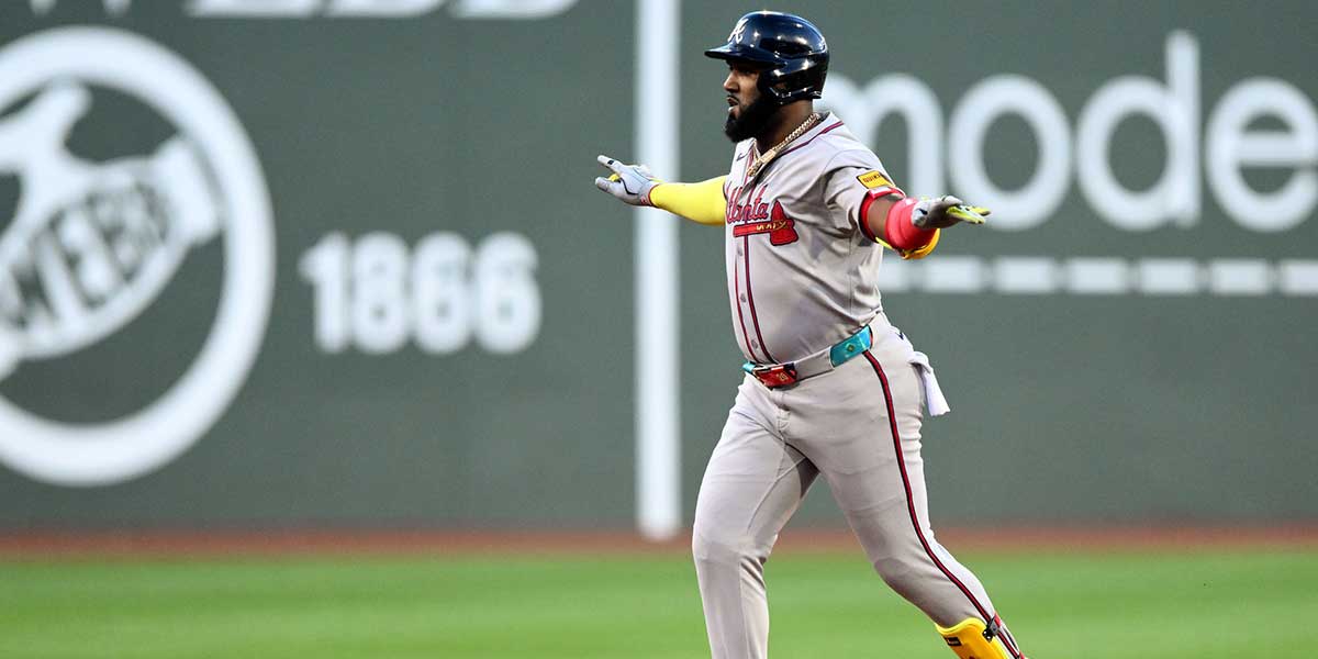 Atlanta Braves designated hitter Marcell Ozuna (20) reacts after hitting a solo home run against the Boston Red Sox during the first inning at Fenway Park.