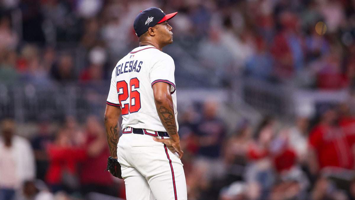 Atlanta Braves relief pitcher Raisel Iglesias (26) reacts after giving up a home run against the St. Louis Cardinals in the ninth inning at Truist Park.