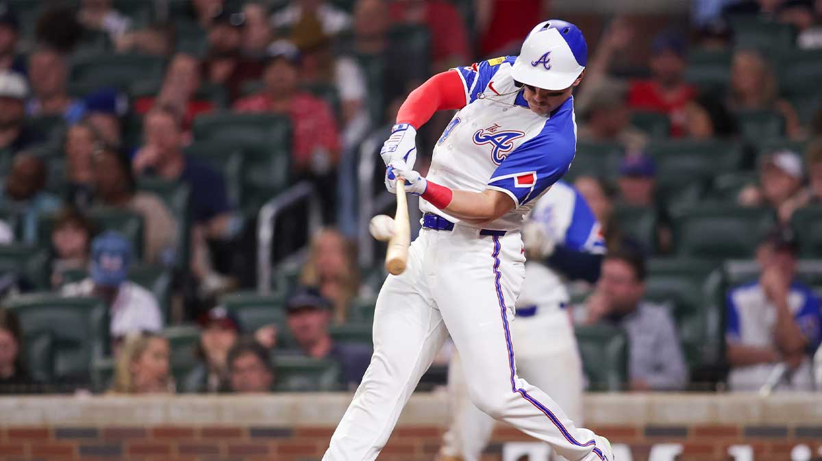 Atlanta Braves right fielder Jarred Kelenic (24) hits a single against the Minnesota Twins in the sixth inning at Truist Park.