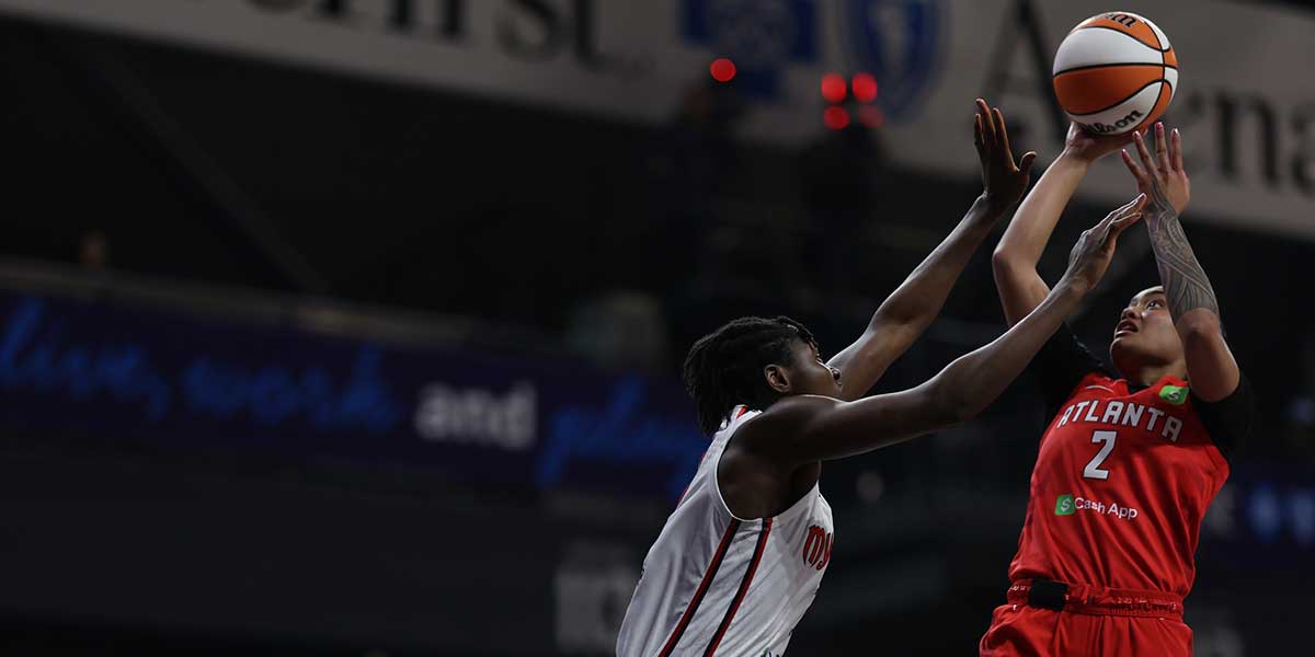 Atlanta Dream guard Te-Hina Paopao (2) shoots the ball as Washington Mystics forward Sika Kone (3) defends in the first half at CareFirst Arena.