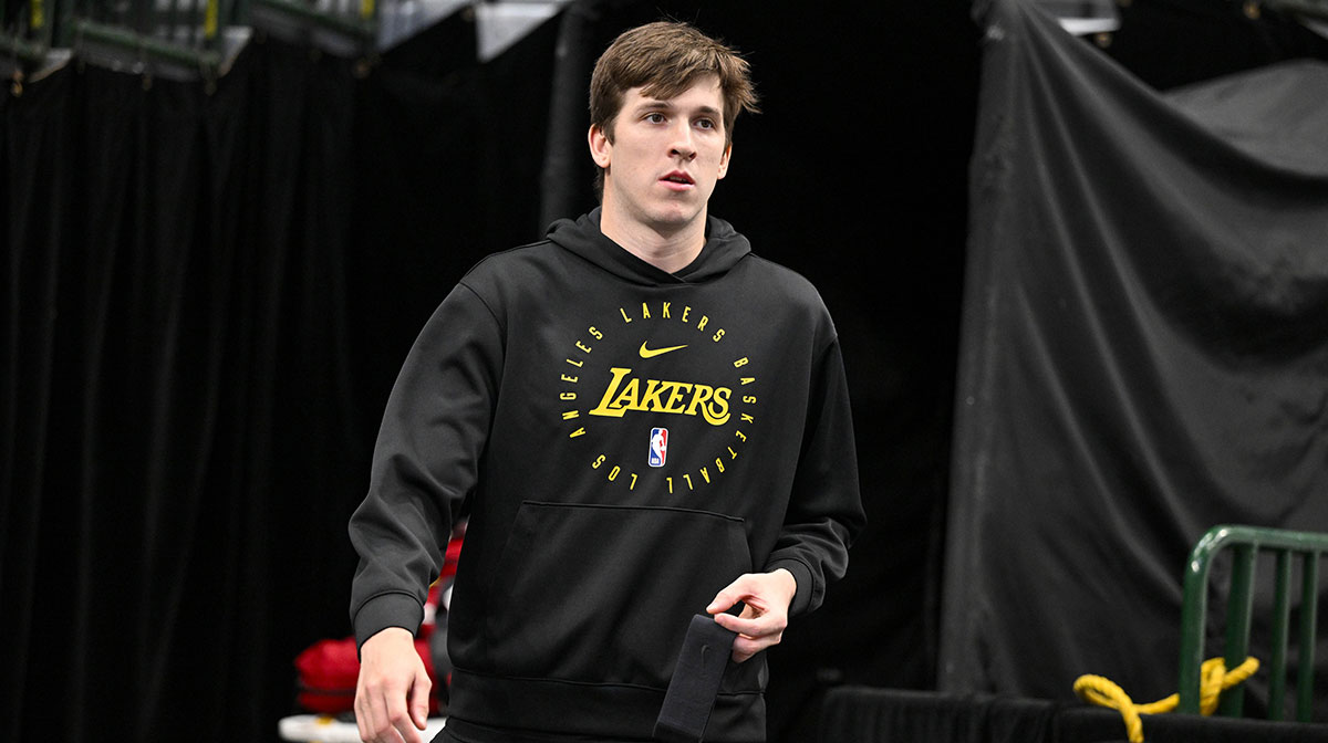Los Angeles Lakers guard Austin Reaves (15) walks on to the court before the game between the Dallas Mavericks and the Los Angeles Lakers during the first quarter at the American Airlines Center.