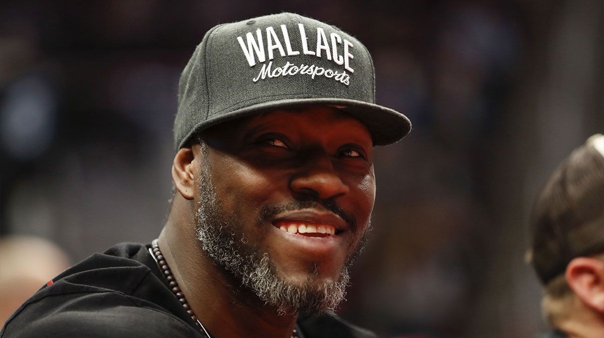 Detroit Pistons retired center Ben Wallace smiles from the stands during the second quarter against the Milwaukee Bucks at Little Caesars Arena.