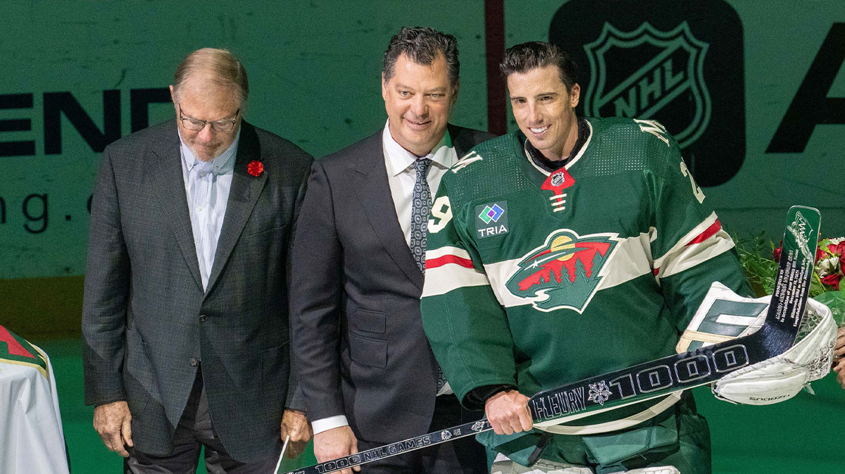 Minnesota Wild owner, Craig Leipold and general manager Bill Guerin award Minnesota Wild goaltender Marc-Andre Fleury (29) with a silver hockey stick in a pregame ceremony in honor of 552 wins and 1000 games played in the NHL before the game against the Pittsburgh Penguins at Xcel Energy Center