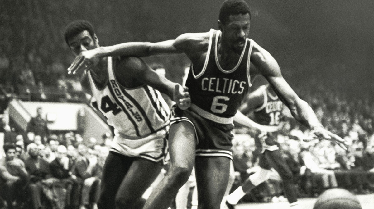 Boston Celtics center Bill Russell (6) fights for a loose ball against Cincinnati Royals guard Oscar Robertson (14) at Cincinnati Gardens.