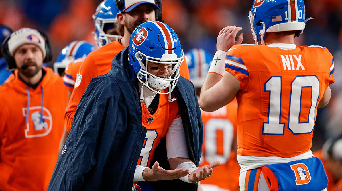 Denver Broncos quarterback Jarrett Stidham (8) celebrates with quarterback Bo Nix (10) after a play in the fourth quarter against the Kansas City Chiefs.