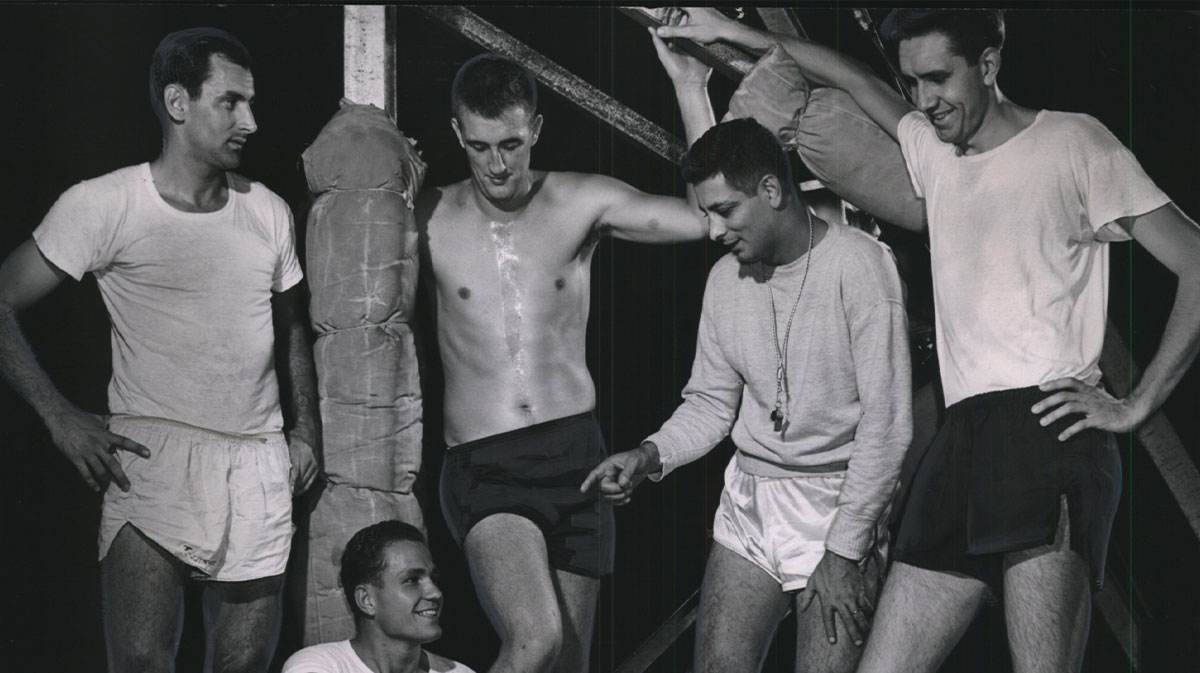 There wasn't much time for rest Monday as the Milwaukee Hawks professional basketball team started practice, but Coach Fuzzy Levane got together with several newcomers during a brief time out. Left to right are Bill Tosheff, Don Sunderlage, Bob Houbregs, Levane and Grant Wittberger. Tosheff formerly played with the Indianapolis Olympians, Sunderlage with Illinois, Houbregs with the University of Washington and Wittberger with Marquette and the Allen-Bradley's. The club is working out at the Arena. 1953 Press Photo Milwaukee Hawks Professional Basketball Team Starts Practice