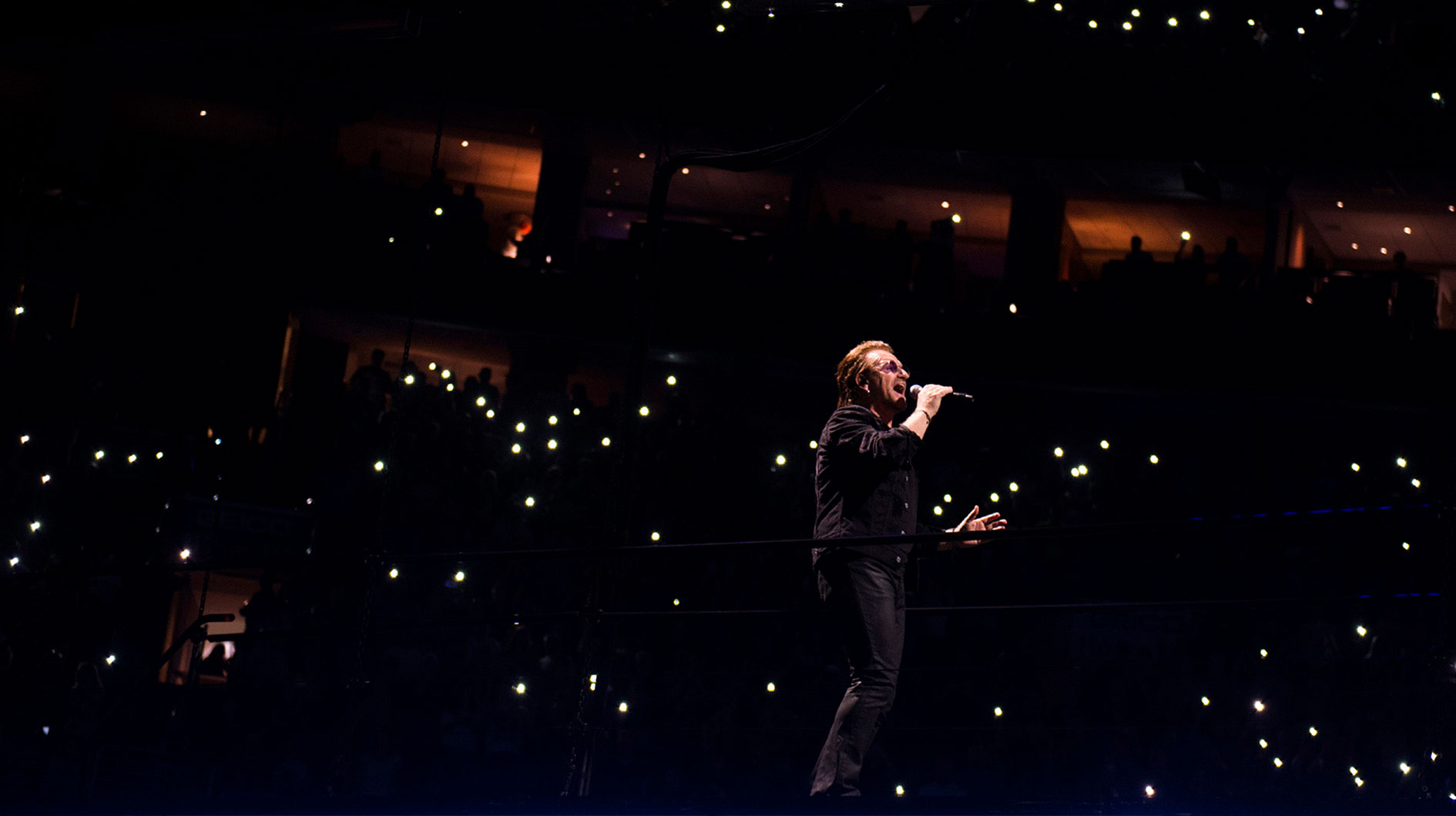U2 lead singer Bono, who recently gave a health update on drummer Larry Mullen Jr, singing in 2018 on their Experience + Innocence Tour.
