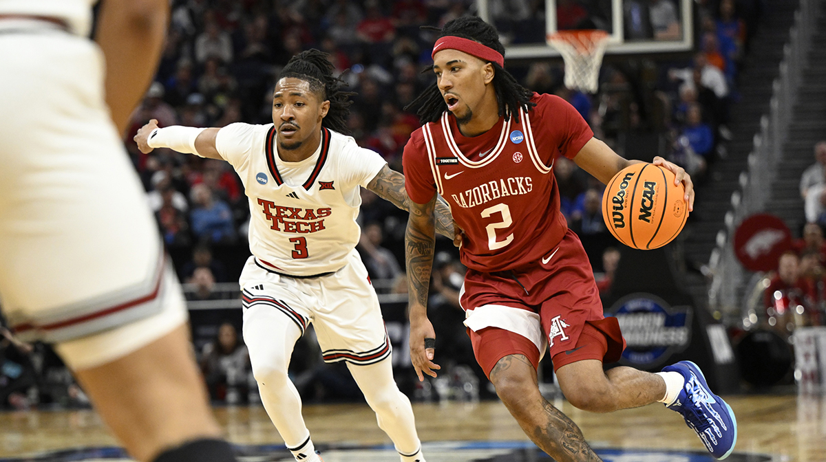 Arkansas Razorbacks guard Boogie Fland (2) drives to the hoop past Texas Tech Red Raiders guard Elijah Hawkins (3) during the first half during a West Regional semifinal of the 2025 NCAA tournament at Chase Center.