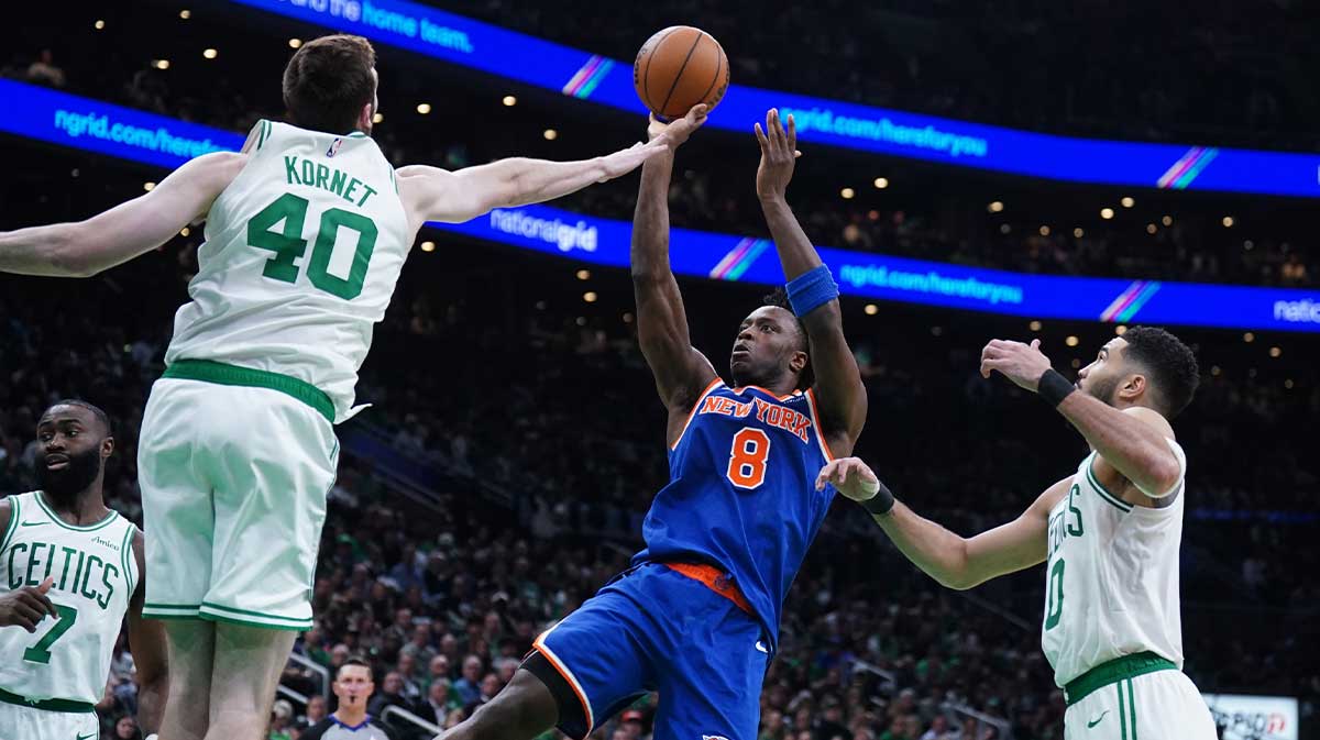 New York Knicks forward OG Anunoby (8) shoots the ball against Boston Celtics center Luke Kornet (40) in the second quarter during game one of the second round for the 2025 NBA Playoffs at TD Garden.