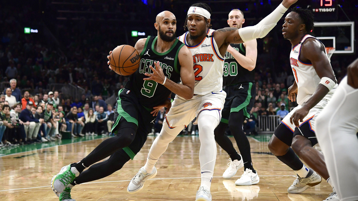 Boston Celtics guard Derrick White (9) controls the ball while New York Knicks guard Miles McBride (2) defends in the second half during game five of the second round for the 2025 NBA Playoffs at TD Garden.