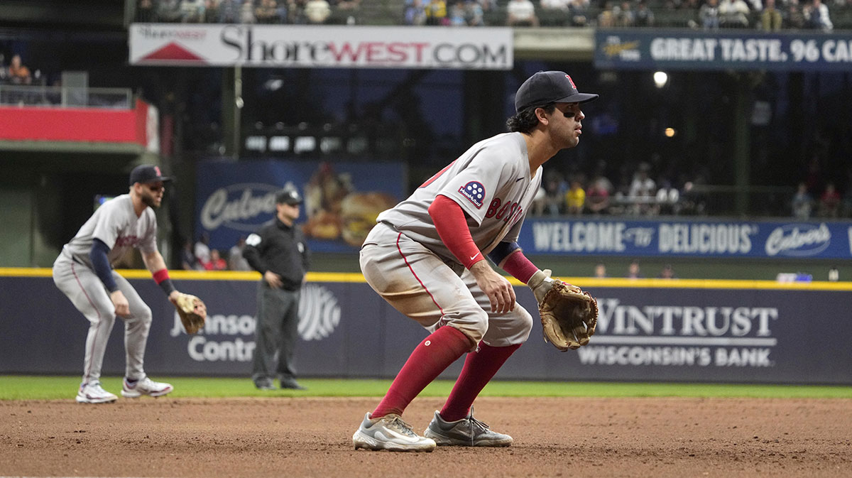Boston Red Sox shortstop Marcelo Mayer (39), right and Boston Red Sox shortstop Trevor Story (10) prepare for a hit against the Milwaukee Brewers in the seventh inning at American Family Field.