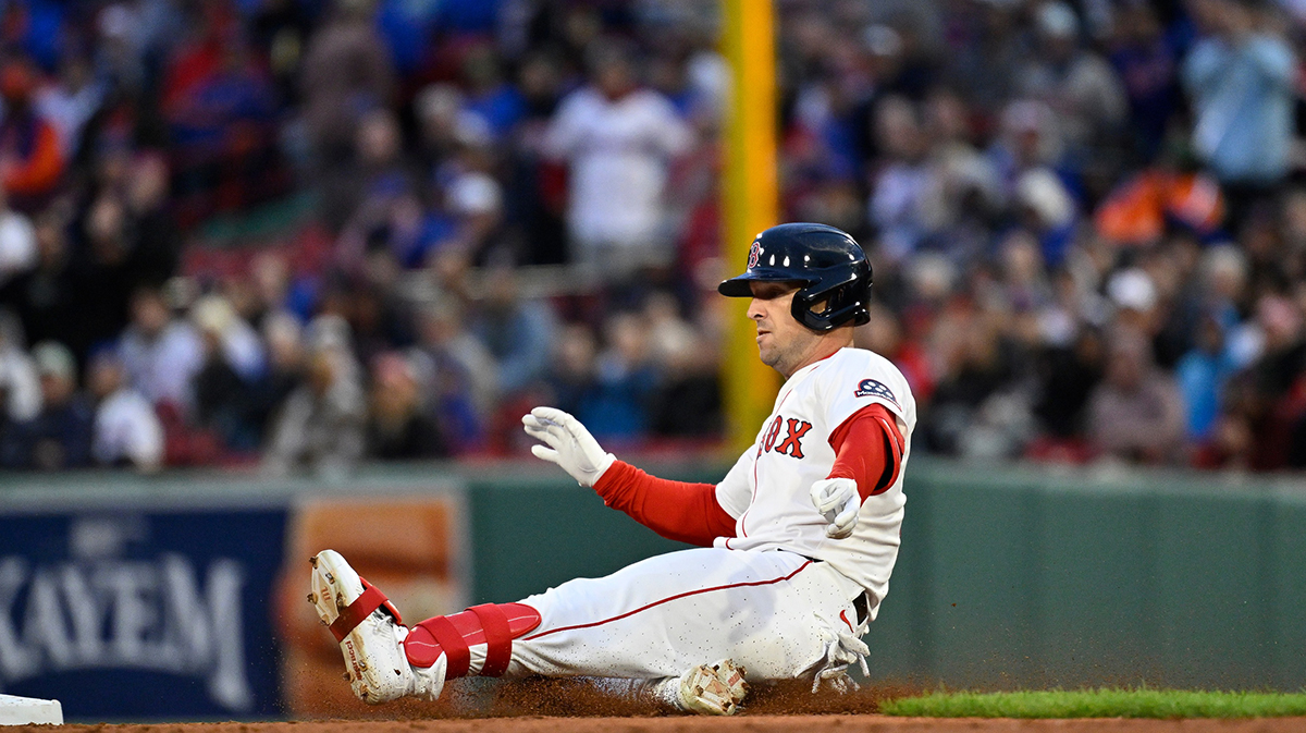 Boston Red Sox third baseman Alex Bregman (2) slides into second base during the third inning against the New York Mets at Fenway Park.