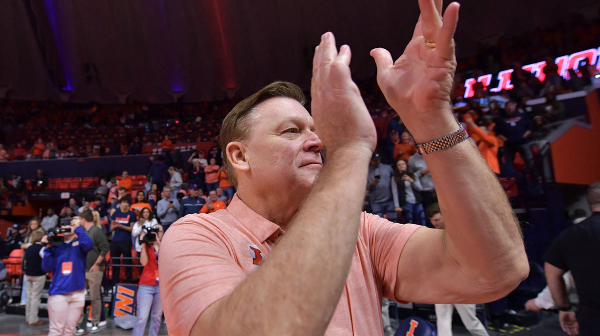 Illinois Fighting Illini head coach Brad Underwood applauds the crowd before the first half against the Northwestern Wildcats at State Farm Center.